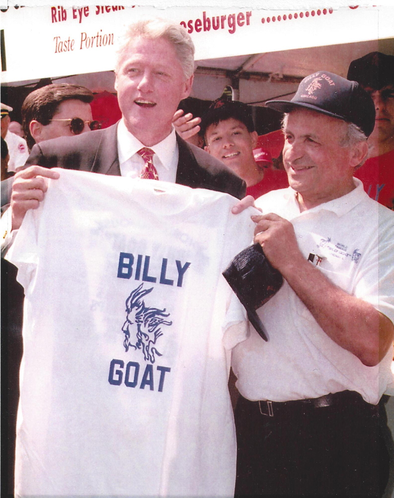 Bill-Clinton-at-Taste-holding-up-shirt
