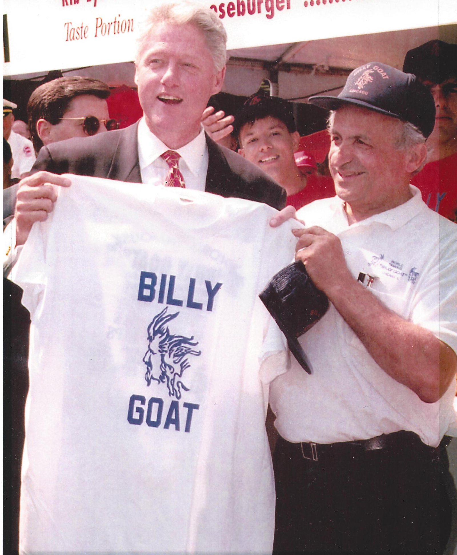 Bill-Clinton-at-Taste-holding-up-shirt